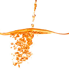 Image showing orange water splash isolated on white