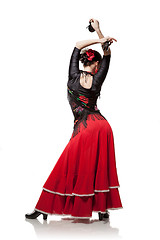 Image showing young woman dancing flamenco with castanets isolated on white