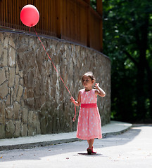 Image showing Little girl with balloon