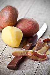 Image showing healthy organic peeled potatoes and knife 