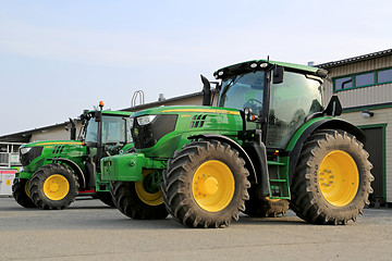 Image showing Two John Deere Agricultural Tractors