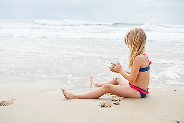 Image showing Young girl playing at beach