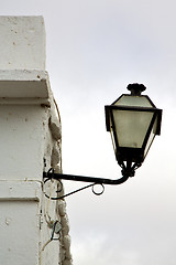 Image showing spain street lamp a bulb in the cloudy sky 