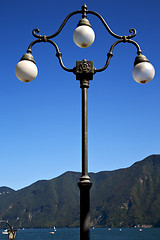 Image showing street lamp a bulb in the   sky lake of lugano Switzerland 