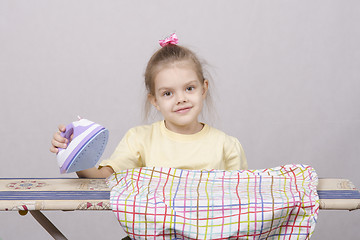 Image showing Portrait of a five year old girl with iron