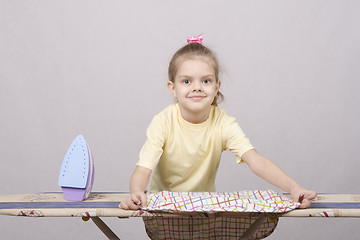 Image showing The girl turns underwear when Ironing