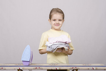 Image showing Girl petting things iron