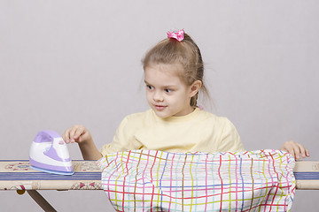 Image showing girl petting iron