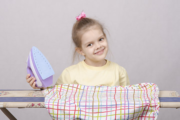 Image showing Portrait of girl with the iron