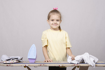 Image showing the girl starts to iron