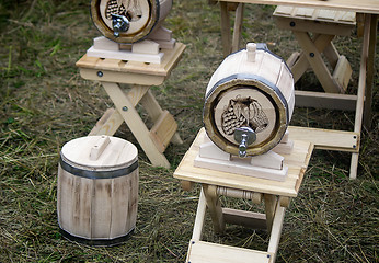 Image showing Wooden oak barrel wine, beer with metal crane. Sold at the fair.