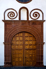 Image showing  lanzarote  spain canarias brass    closed wood  church  wall ab