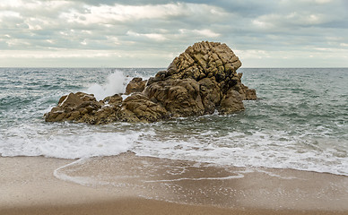 Image showing Wave breaking on a rock