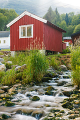 Image showing Red wooden cabin at campsite