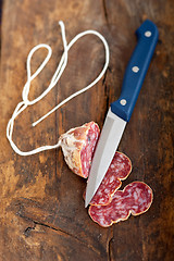 Image showing italian salame pressato pressed slicing