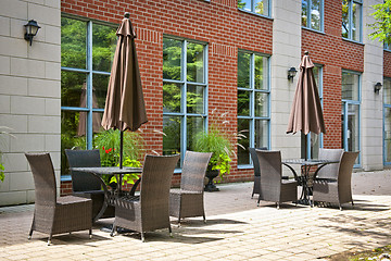 Image showing Tables and chairs on outdoor patio