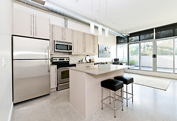 Image showing Modern condo kitchen and living room