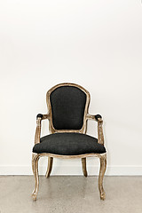 Image showing Antique armchair near wall