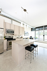 Image showing Modern condo kitchen and living room