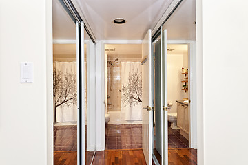 Image showing Mirrored closets and bathroom