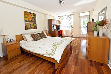 Image showing Bedroom interior with hardwood floor