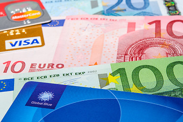Image showing Global Blue, Visa and MasterCard credit cards on Euro banknotes