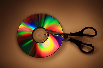 Image showing damaged CD or DVD in the dark night