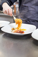 Image showing Chef plating up seafood pasta