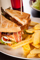 Image showing Club sandwich with potato French fries