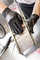 Image showing Chef slicing boiled beetroot