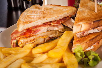 Image showing Club sandwich with potato French fries