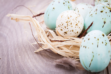 Image showing Three natural blue Easter eggs in a basket