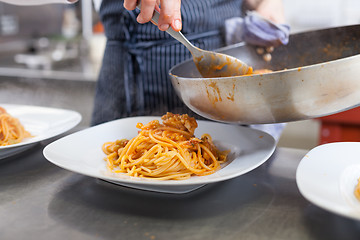 Image showing Chef plating up seafood pasta