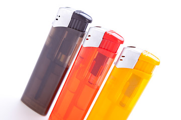 Image showing Vividly coloured plastic lighters