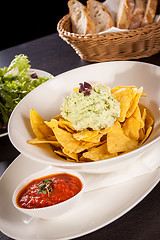 Image showing Crisp corn nachos with guacamole sauce