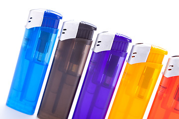 Image showing Vividly coloured plastic lighters