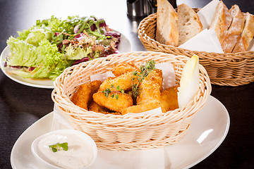 Image showing Crumbed chicken nuggets in a basket