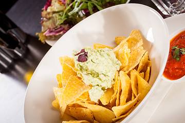 Image showing Crisp corn nachos with guacamole sauce