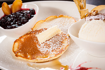 Image showing tasty sweet pancakes with vanilla icecream and topping