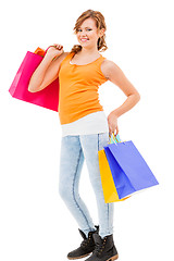 Image showing attractive young woman with colorful shopping bags