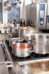 Image showing Cooking in a commercial kitchen