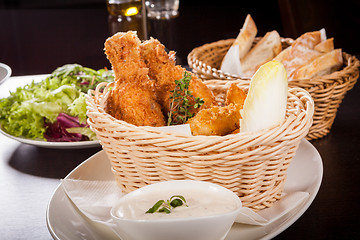 Image showing Crisp crunchy golden chicken legs and wings