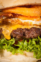 Image showing Delicious egg and bacon cheeseburger