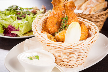 Image showing Crisp crunchy golden chicken legs and wings