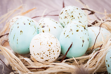 Image showing Three natural blue Easter eggs in a basket