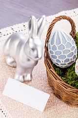 Image showing Easter still life with a silver bunny and eggs