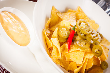 Image showing Nachos with cheese sauce and chilli pepperoni