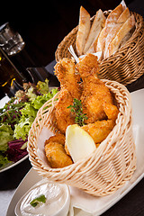 Image showing Crisp crunchy golden chicken legs and wings