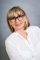 Image showing Scholarly attractive woman in glasses