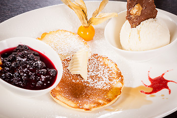 Image showing tasty sweet pancakes with vanilla icecream and topping